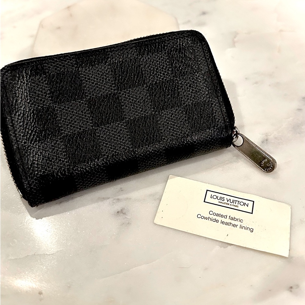 Louis Vuitton black checkered zippy coin purse.